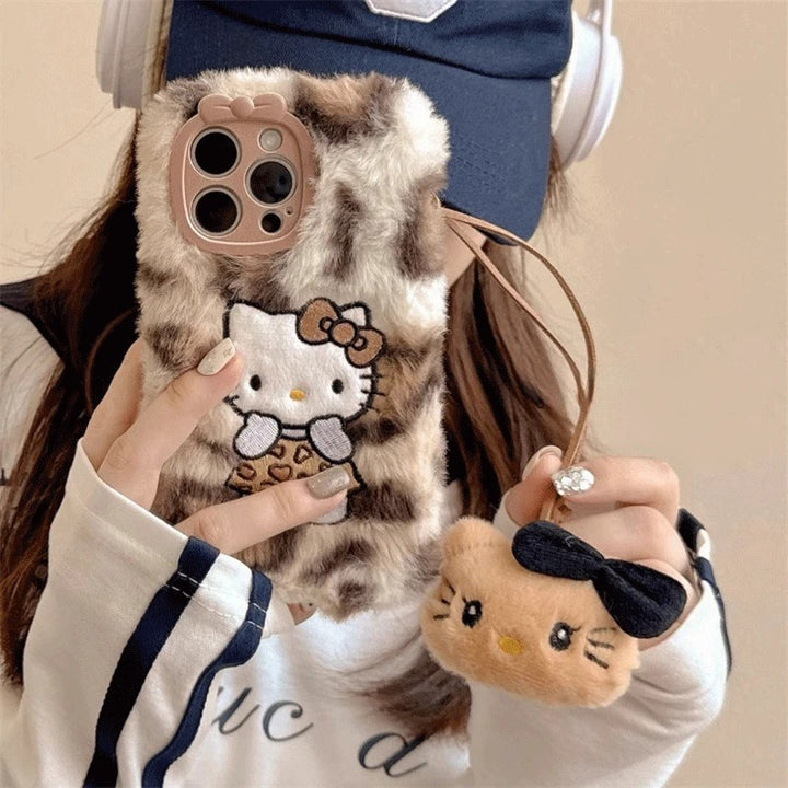 [Sanrio] New Autumn And Winter Plush Embroidered Cute Leopard print Hello Kitty Phone Case, Compatible with iPhone Models 11 to 16.max Simple and Fashionable Autumn and Winter Models. It's a Perfect Gift for Any Occasion.